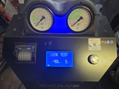 Image Captioned: Leak test as part of aircon regas.