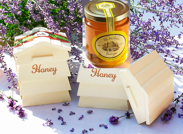 Photo of Wooden Beehive with a Jar of Clear Honey