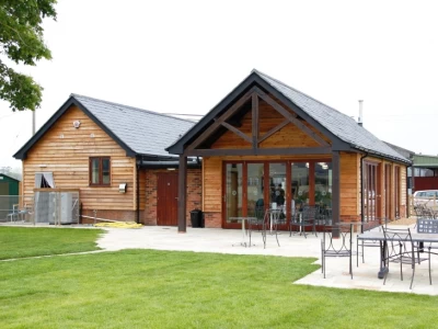 Image Captioned: Cafe and ice cream manufacturing building at dairy farm