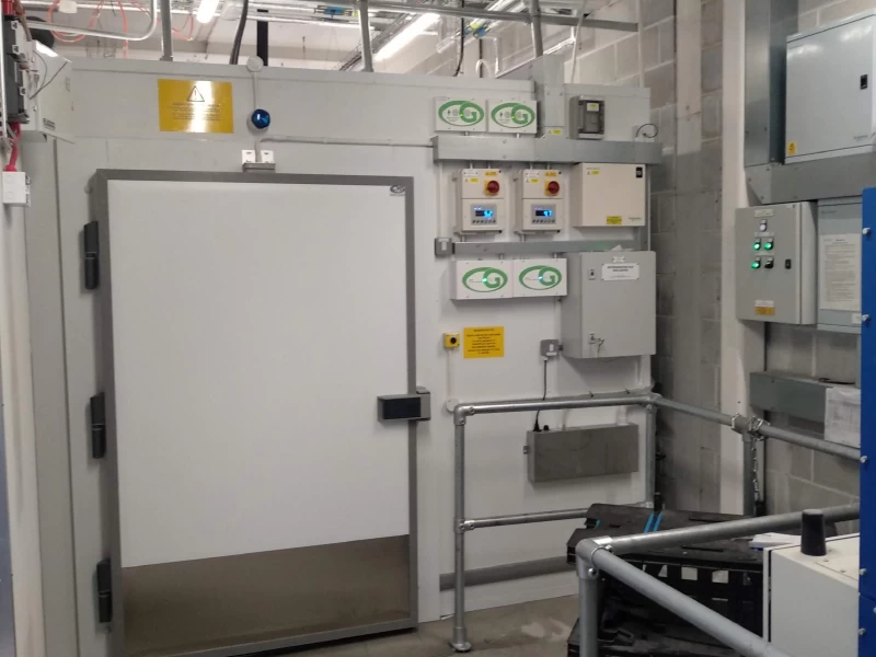 Large white door leading to cold room behind the scenes at retail foodhall