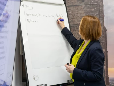 Image Captioned: Capturing a discussion on a flipchart