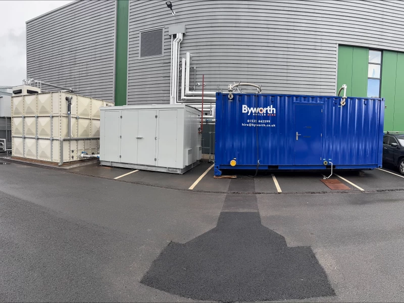 Grey metal rectangular housing for the new steam system