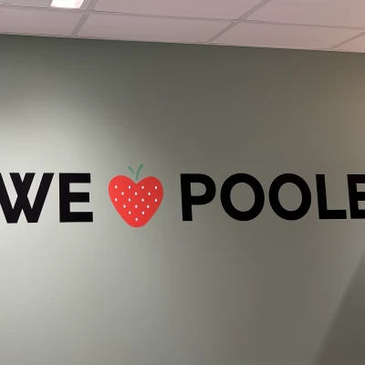 We Love Poole graphic on a wall inside M&S store