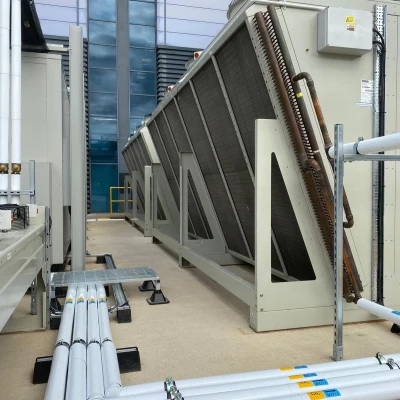 Photo of external service cladding and pipes.