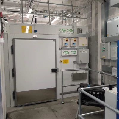 Large white door leading to cold room behind the scenes at retail foodhall