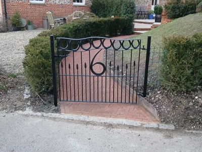 Image Captioned: Our customer had an idea and we worked on the design together, from a chalk drawing to a very unique gate. One very happy customer.