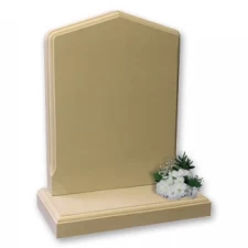Deep carved flower enhances the rounded top of this memorial