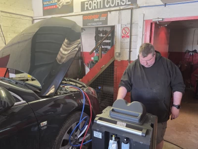 Image Captioned: Andy checking diagnostic results