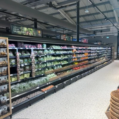 A chilled cabinet containing vegetables in M&S Foodhall