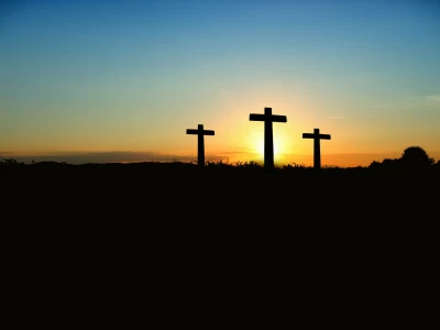 Image Captioned: Crosses on the hill at Easter.